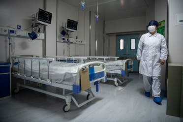 A nurse walks inside a quarantine room at the Shanghai Public Clinical Center, on February 17, 2020. (File photo: AFP)