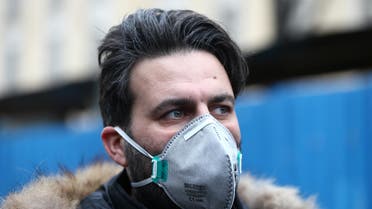 An Iranian man wearing a protective mask to prevent contracting a coronavirus walks at Grand Bazaar in Tehran, Iran February 20, 2020. - Reuters