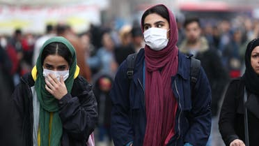 Iranian women wear protective masks to prevent contracting a coronavirus, as they walk at Grand Bazaar in Tehran, Iran. (Reuters) 