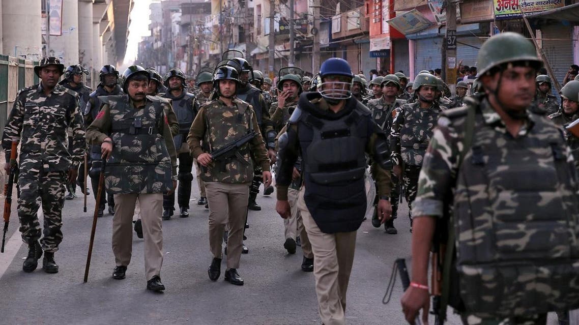 Paramilitary troops patrol in a riot affected area after clashes erupted between people demonstrating for and against a new citizenship law in New Delhi. (Reuters)