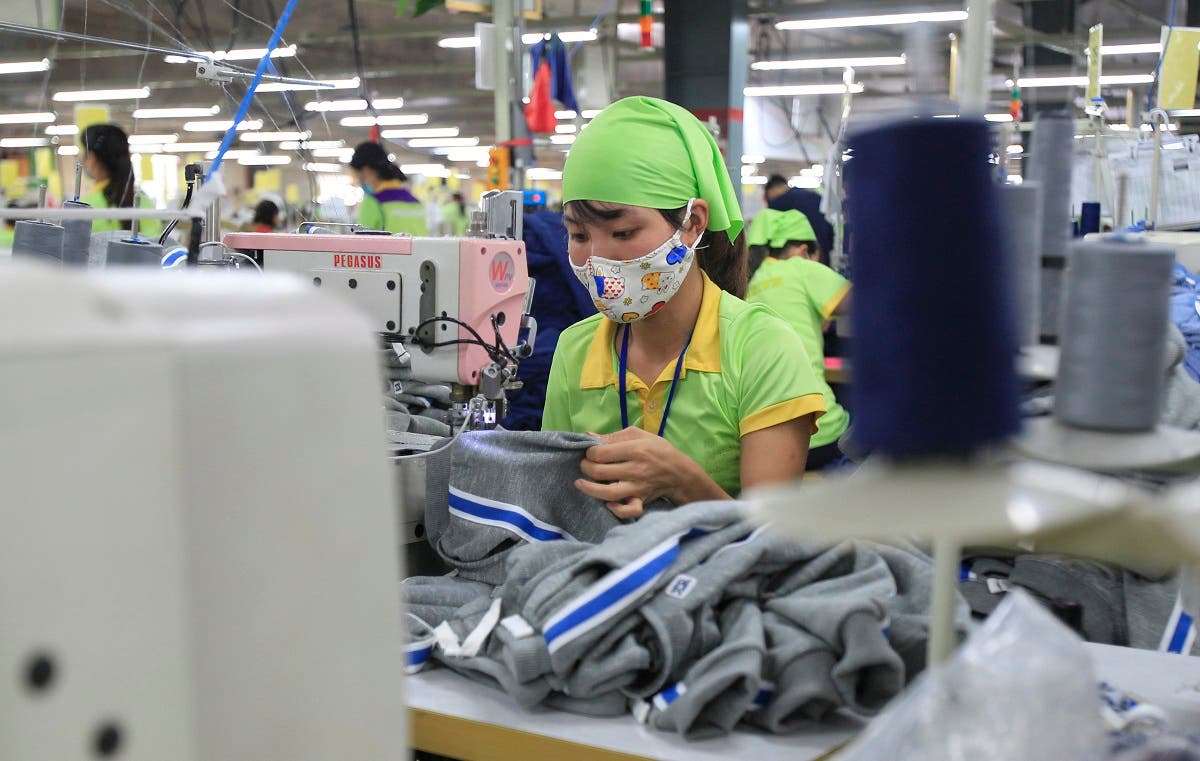 A garment worker sews clothes at Pro Sports factory in Nam Dinh province, Vietnam. (File photo: AP)