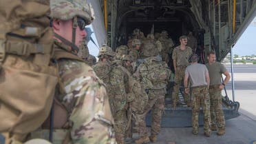 U.S. Army soldiers, assigned to the East Africa Response Force (EARF), 101st Airborne Division on a mission to bolster the security of Manda Bay Airfield, Kenya after an attack by Somalia's al Shabaab militants that killed three Americans, board a transport plane in Camp Lemonnier, Djibouti January 5, 2020. Picture taken January 5, 2020. U.S. Air Force/Senior Airman Daniel Hernandez/Handout via REUTERS.