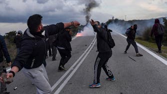 Greek islanders clash with police over new migrant center