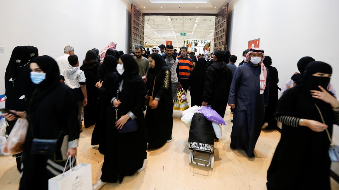 Locals wear face masks to take precautions from coronavirus, as they shop at the Bahrain's Autumn Fair 2020, in Manama, Bahrain January 29, 2020. (Reuters)