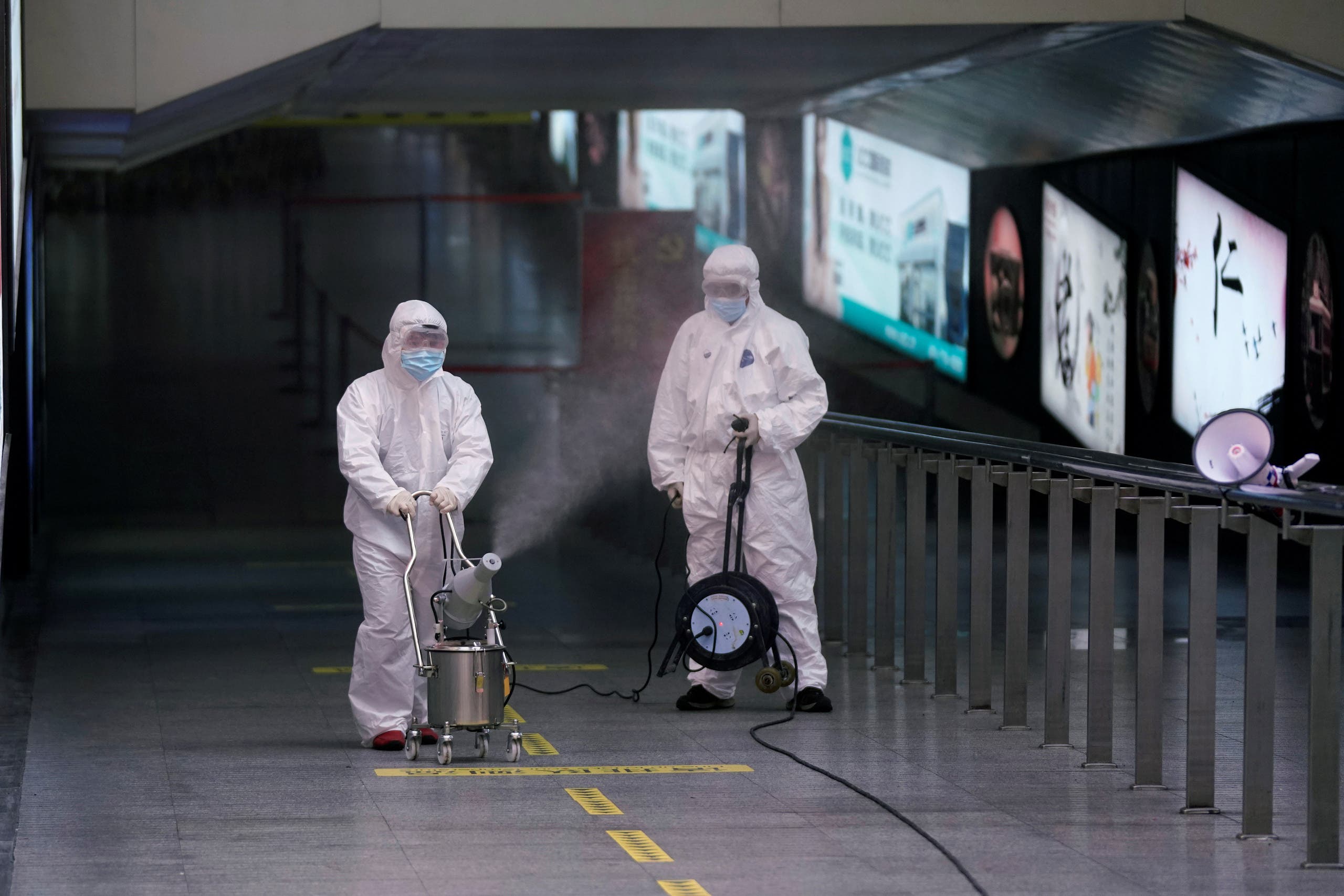 Workers with sanitizing equipment disinfect at the Shanghai railway station in Shanghai, China, as the country is hit by an outbreak of a new coronavirus, February 27, 2020. (Reuters)