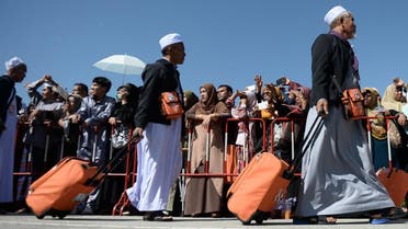 Thai Muslims board a special flight to the holy city of Mecca for the annual Hajj pilgrimage from Narathiwat provincial airport in southern Thailand on July 4, 2019. (AFP)