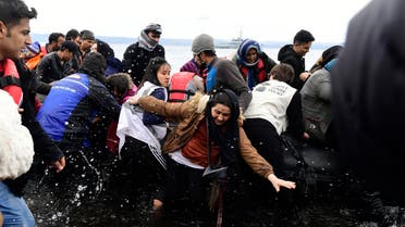 Migrants arrive with a dinghy at the village of Skala Sikaminias, on the Greek island of Lesbos, after crossing the Aegean sea from Turkey, on Friday, Feb. 28, 2020. (AP)