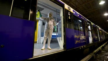 A Tehran Municipality worker cleans a metro train to avoid the spread of the COVID-19 illness on February 26, 2020. (Reuters)