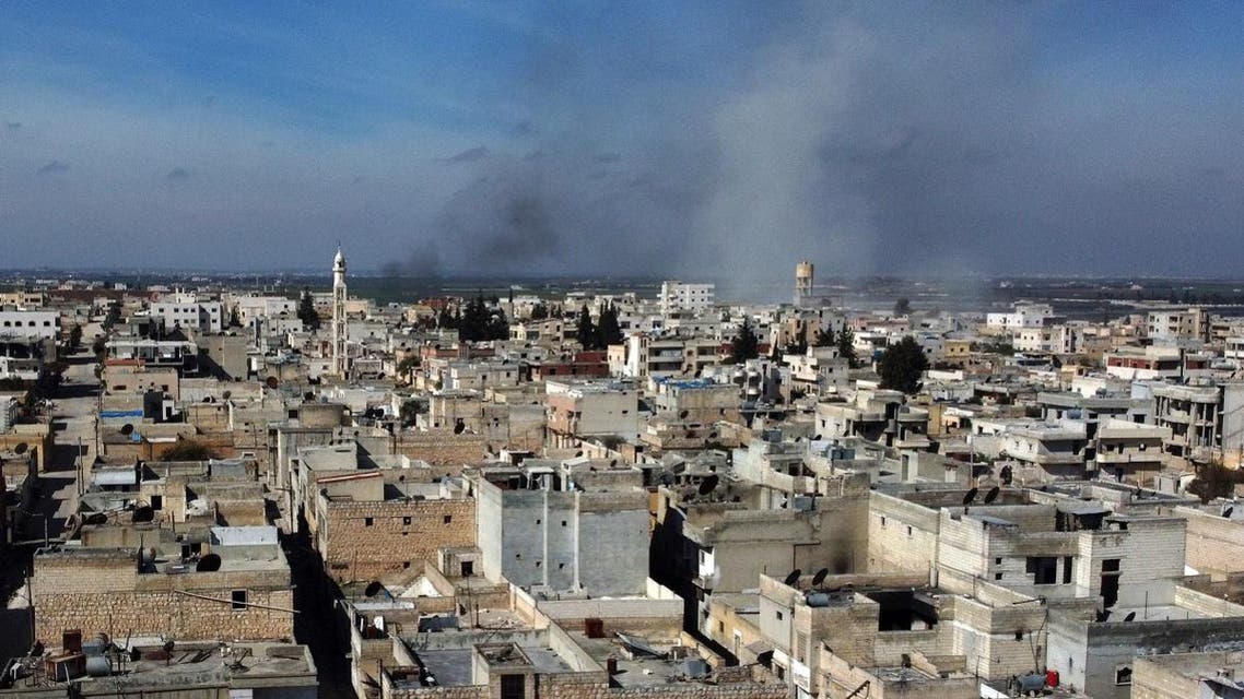 Smoke billows over the town of Saraqib in the eastern part of the Idlib province in northwestern Syria, following bombardment by Syrian government forces, on February 27, 2020. (AFP)