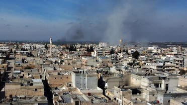 Smoke billows over the town of Saraqib in the eastern part of the Idlib province in northwestern Syria, following bombardment by Syrian government forces, on February 27, 2020. (AFP)