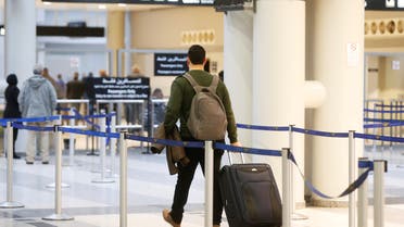 Habib Rahhal, 28, carries his luggage as he heads to board a plane to Germany, at Beirut international airport, Lebanon February 12, 2020. (File photo: Reuters)