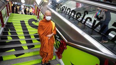 A Buddhist monk wearing a face mask to protect himself from a new virus at a skytrain station in Bangkok, Thailand on Feb. 7, 2020. (File photo: AP)