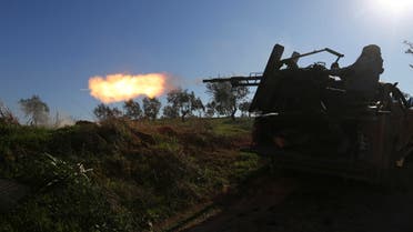 Turkish-backed Syrian fighter fires at a frontline near the town of Saraqib in Idlib province on Feb. 26, 2020. (AP)