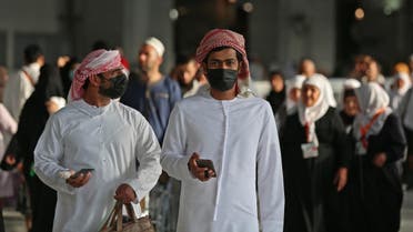 Muslim pilgrims wear masks at the Grand Mosque in Saudi Arabia's holy city of Mecca on February 28, 2020. (AFP)