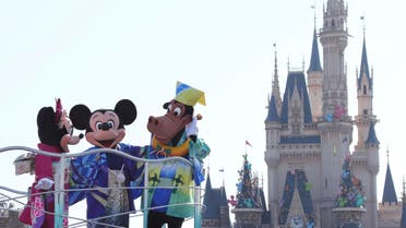 In this photo, Mickey Mouse, Minnie Mouse, and Horace Horsecollar entertain visitors to the Tokyo Disneyland. (File photo: AP)
