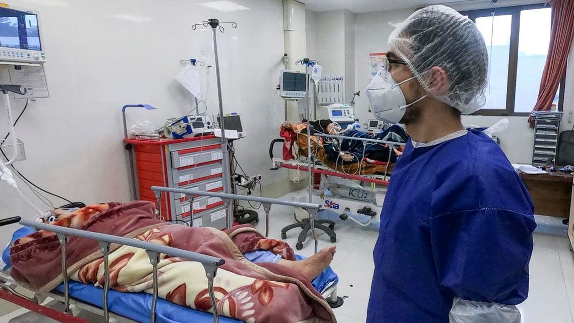 A nurse cares for patients in a ward dedicated for people infected with the coronavirus, at Forqani Hospital in Qom, 78 miles (125 kilometers) south of the capital Tehran, Iran. (AP)