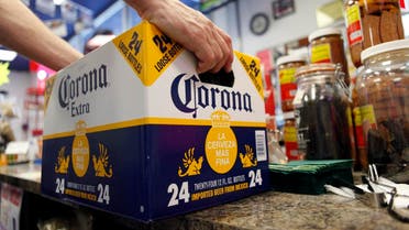 In this April 1, 2010, file photo, a customer places a case of Corona Extra on the checkout counter for purchase at Susquehanna Beer and Soda in Marysville, Pa. (AP)