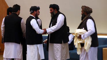Members of Afghanistan s Taliban delegation are seen ahead of an agreement signing between them and US officials in Doha Qatar February 29 2020 2
