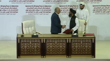 THUMBNAIL_ US negotiator and Taliban co-founder shake hands after signing historic deal 