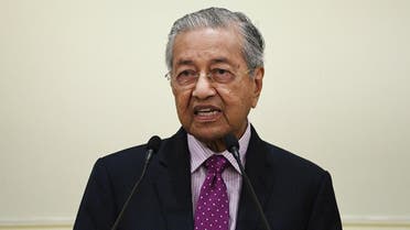 Mahathir Mohamad speaks as he unveils an economic stimulus plan aimed at combating the impact from the novel coronavirus in Putrajaya on February 27, 2020. (AFP)