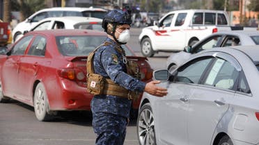 A member of the Iraqi security forces wears a protective face mask, following the coronavirus outbreak, in Baghdad, Iraq, February 29, 2020. (Reuters)