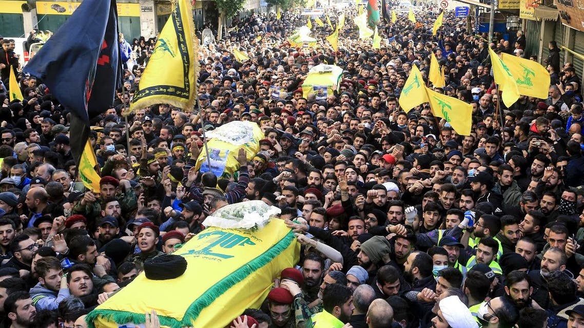 Supporters of Lebanon’s Hezbollah carry the coffins during a funeral procession in a suburb of the Lebanese capital Beirut, on March 1, 2020. (AFP)