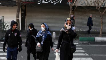 Iranian people wear protective masks to prevent contracting a coronavirus, in Tehran, Iran, February 29, 2020. (Reuters)
