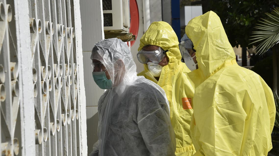 Algerian paramedics wearing protective outfits are pictured in front of El-Kettar hospital's special unit to treat cases of novel coronavirus in the capital Algiers on February 26, 2020. (AFP)