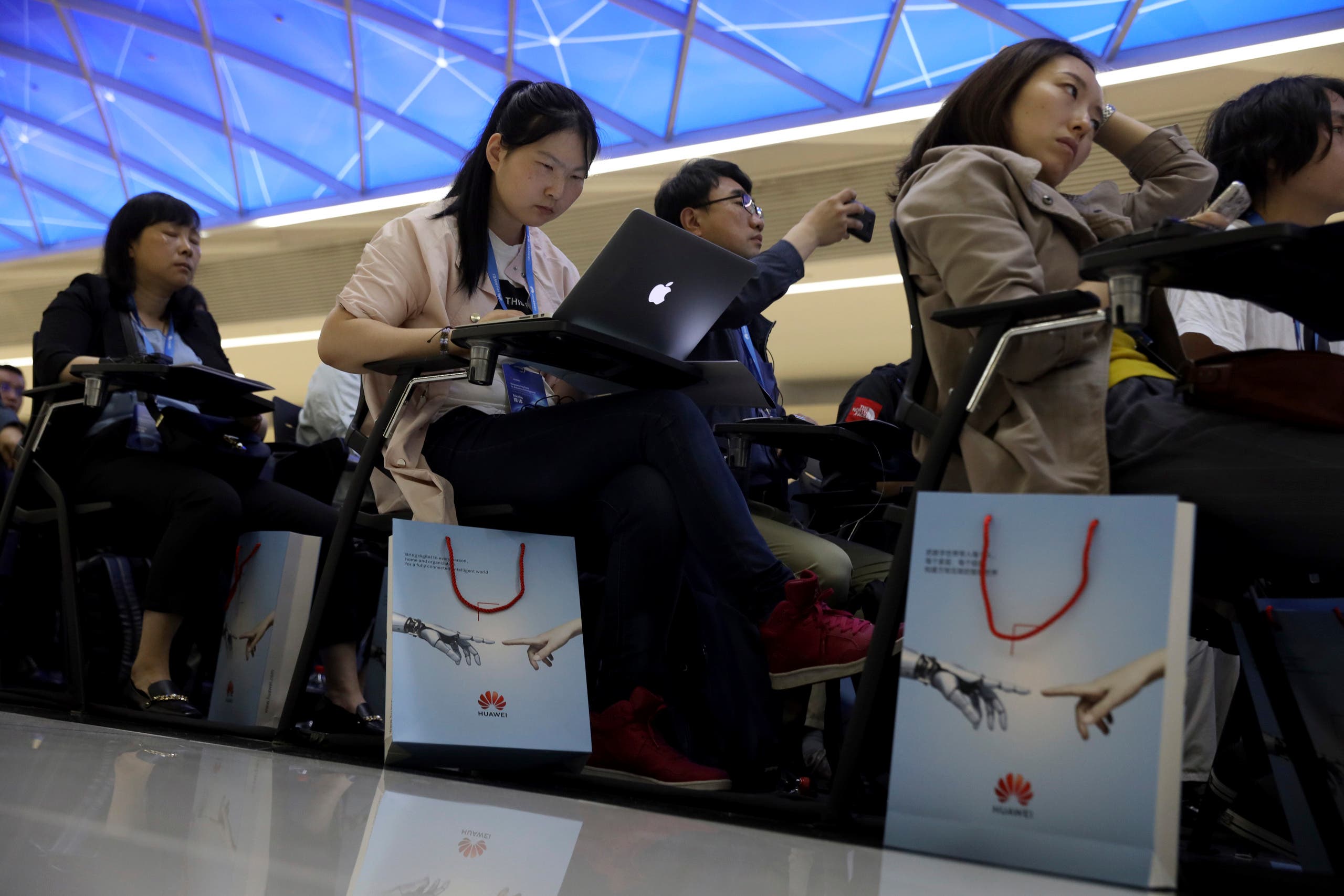 Journalists attend a Huawei event in Beijing on May 15, 2019. (File photo: AP)