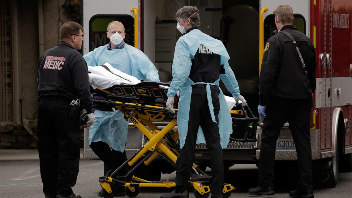 Medics prepare to transfer a patient on a stretcher to an ambulance at the Life Care Center of Kirkland, the long-term care facility linked to the two of three confirmed coronavirus cases in the state, in Kirkland, Washington, US. March 1, 2020. (Reuters)