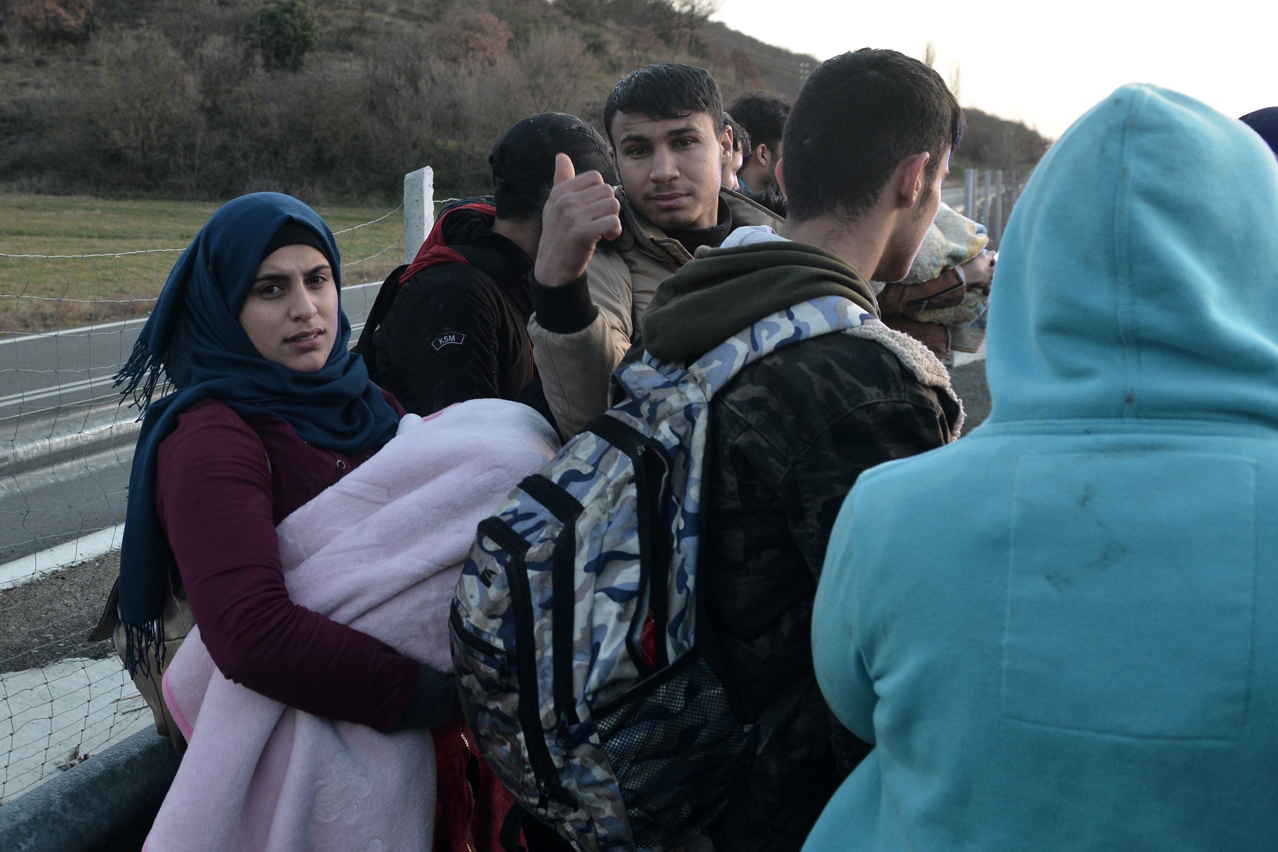 Migrants being arrested by police on the Greek side of the Greece-Turkey border near Kastanies, March 3, 2020. (AFP)