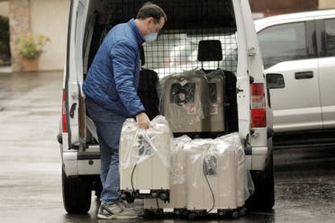A driver delivers oxygen therapy devices at the Life Care Center of Kirkland, the long-term care facility linked to several confirmed coronavirus cases in the state, in Kirkland, Washington, US March 2, 2020. (Reuters)