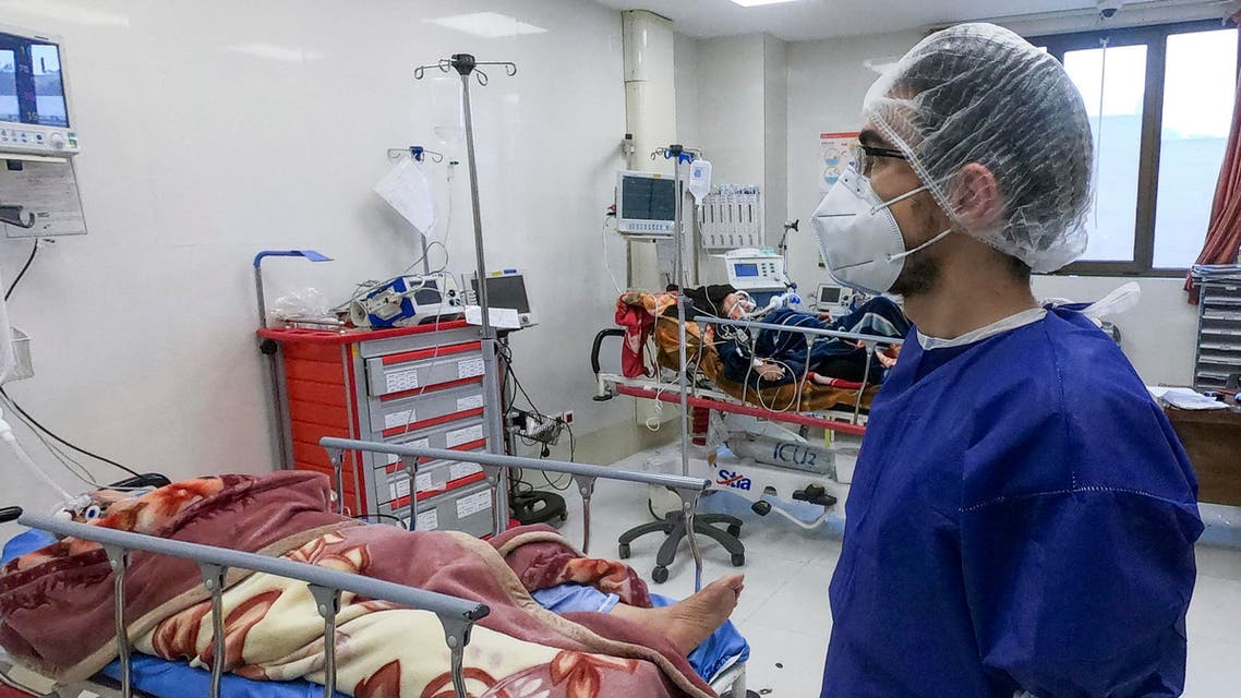 A nurse cares for patients in a ward dedicated for people infected with the coronavirus, at Forqani Hospital in Qom, Iran on Feb. 26, 2020. (AP)