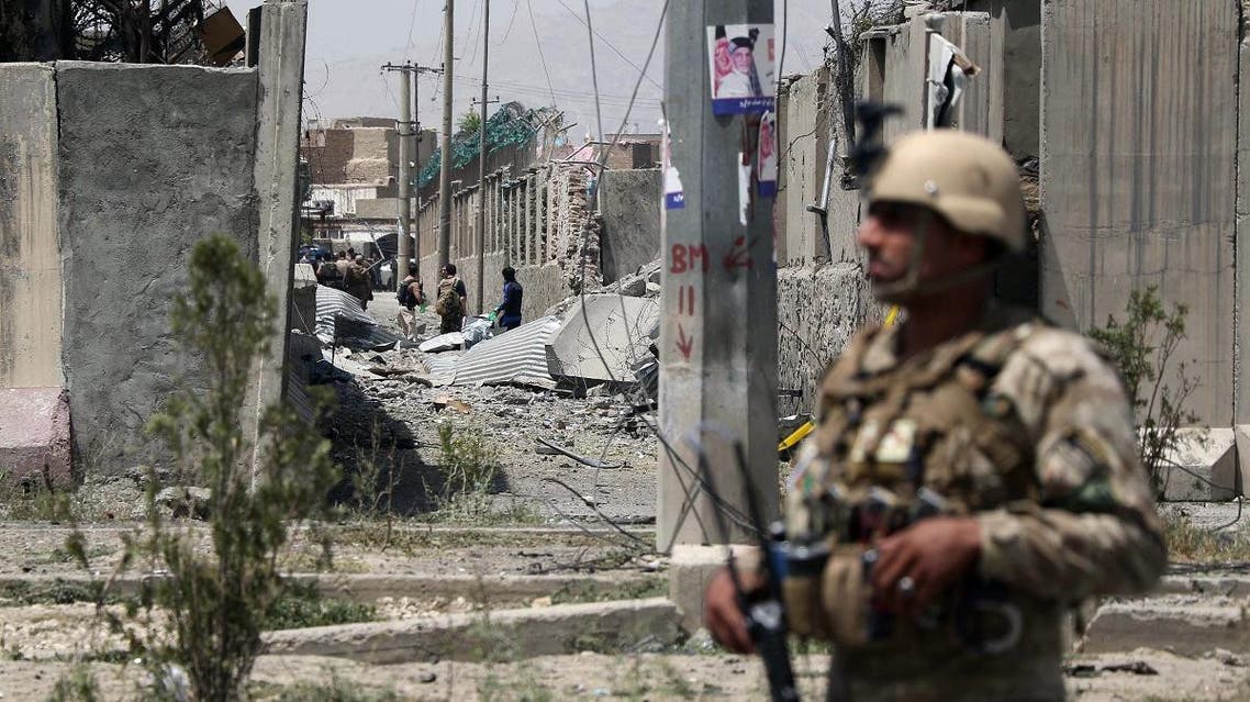 An Afghan security personnel stands guard at the site where a Taliban car bomb detonated at the entrance of a police station in Kabul on August 7, 2019. (File photo: AFP)