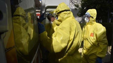 Algerian paramedics wearing protective outfits are pictured in front of El-Kettar hospital's special unit to treat cases of novel coronavirus in the capital Algiers on February 26, 2020. (AFP)
