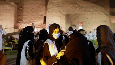 A Saudi tour guide wears a mask, due to the coronavirus, in front of the historical Salwa Palace, originally the home of the country's first founders, in Diriyah, outside Riyadh, Saudi Arabia, Tuesday, Feb. 25, 2020. (AP)