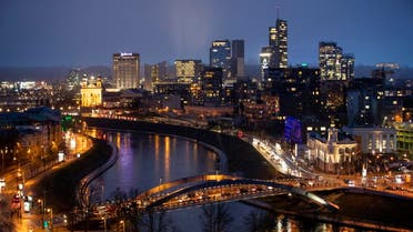 The King Mindaugas bridge crosses the river Neris and buildings of the commercial district are seen during a warm winter evening in Vilnius, Lithuania. (File photo: AP)