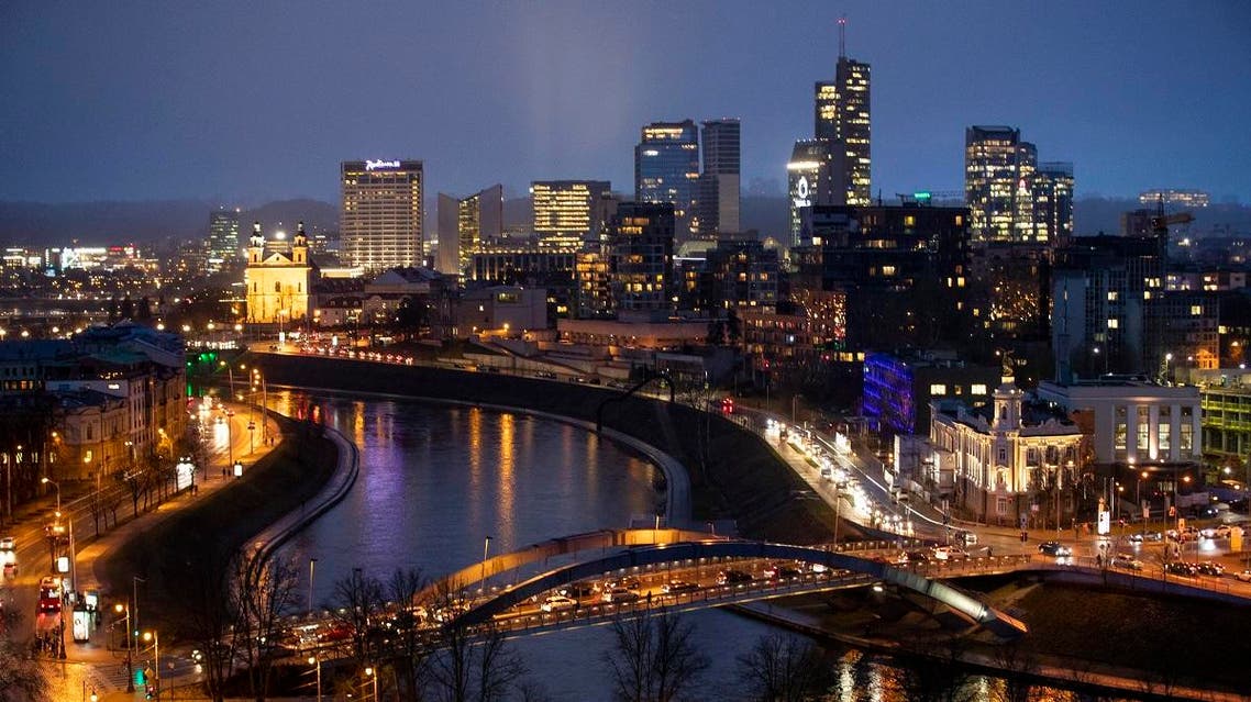 The King Mindaugas bridge crosses the river Neris and buildings of the commercial district are seen during a warm winter evening in Vilnius, Lithuania. (File photo: AP)