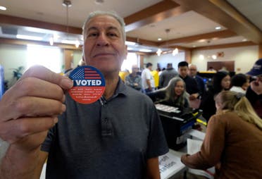 Frank Salazar, 70, shows an “I voted” sticker after casting his ballot on the Super Tuesday, at a voting center in Alhambra, California on March 3, 2020. (AP)
