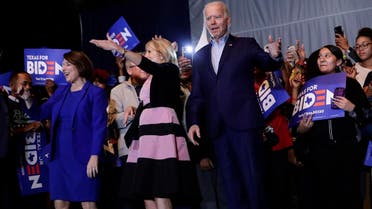 Democratic presidential candidate former Vice President Joe Biden, right, is joined by former rival Sen. Amy Klobuchar, left, during a campaign stop in Dallas, on March 2, 2020. At center is Jill Biden. (AP)