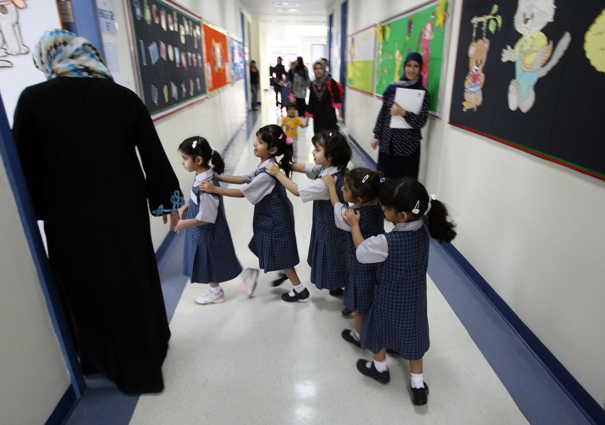 File photo of students lining up as they enter their classroom on the first day of the academic year for public schools in Dubai on September 27, 2009. (File photo: AFP)