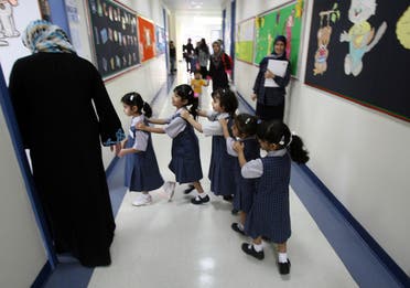 File photo of pupils line-up as they ente their classroom on the first day of the academic year for public schools in Dubai on September 27, 2009. (File photo: AFP)