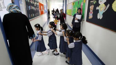 File photo of pupils line-up as they ente their classroom on the first day of the academic year for public schools in Dubai on September 27, 2009. (File photo: AFP)