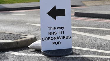 A sign directs directs patients to an NHS 111 Coronavirus Pod testing service area for COVID-19 assessment at Pinderfields Hospital in Wakefield, northwest England, March 4, 2020. (AFP)