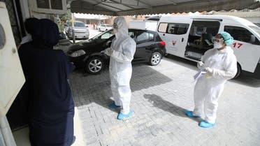 Doctors call a traveler who returned from Iran at their residency, to check if is infected with the novel coronavirus, at Isa Town Health Center, south of Manama. (Reuters)