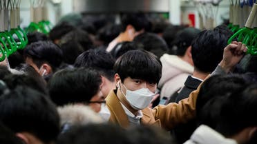 A man wearing a mask as a preventive measure against the coronavirus rides on a train in Seoul. (File photo: Reuters)