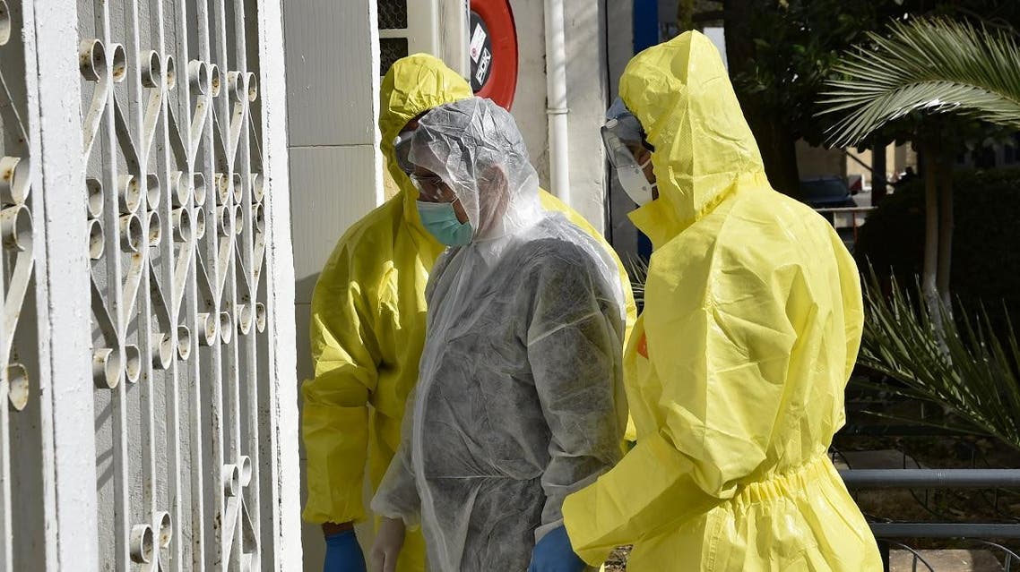 Algerian paramedics wearing protective outfits are pictured in front of El-Kettar hospital's special unit to treat cases of novel coronavirus in the capital Algiers on February 26, 2020. (AFP)