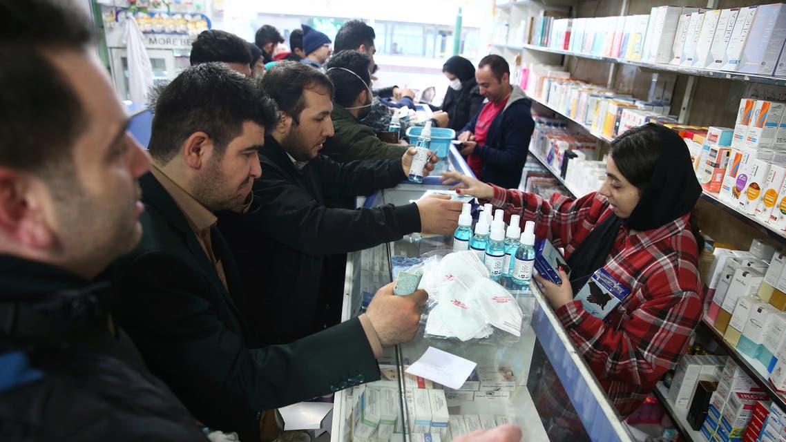 Iranians buy protective masks in a drug store to prevent contracting a coronavirus, in Tehran, Iran, February 20, 2020. (Reuters)
