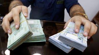 Lebanese lira plummets to half its official value