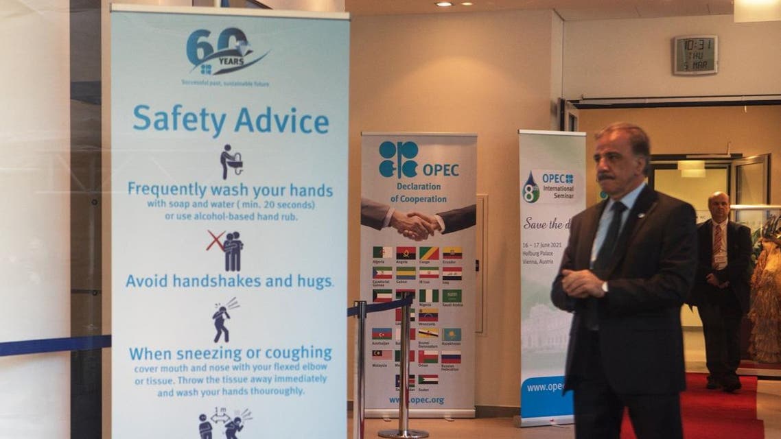A banner gives safety instructions to advise people how to protect against a coronavirus infetion at the foyer of the OPEC building. (AFP)